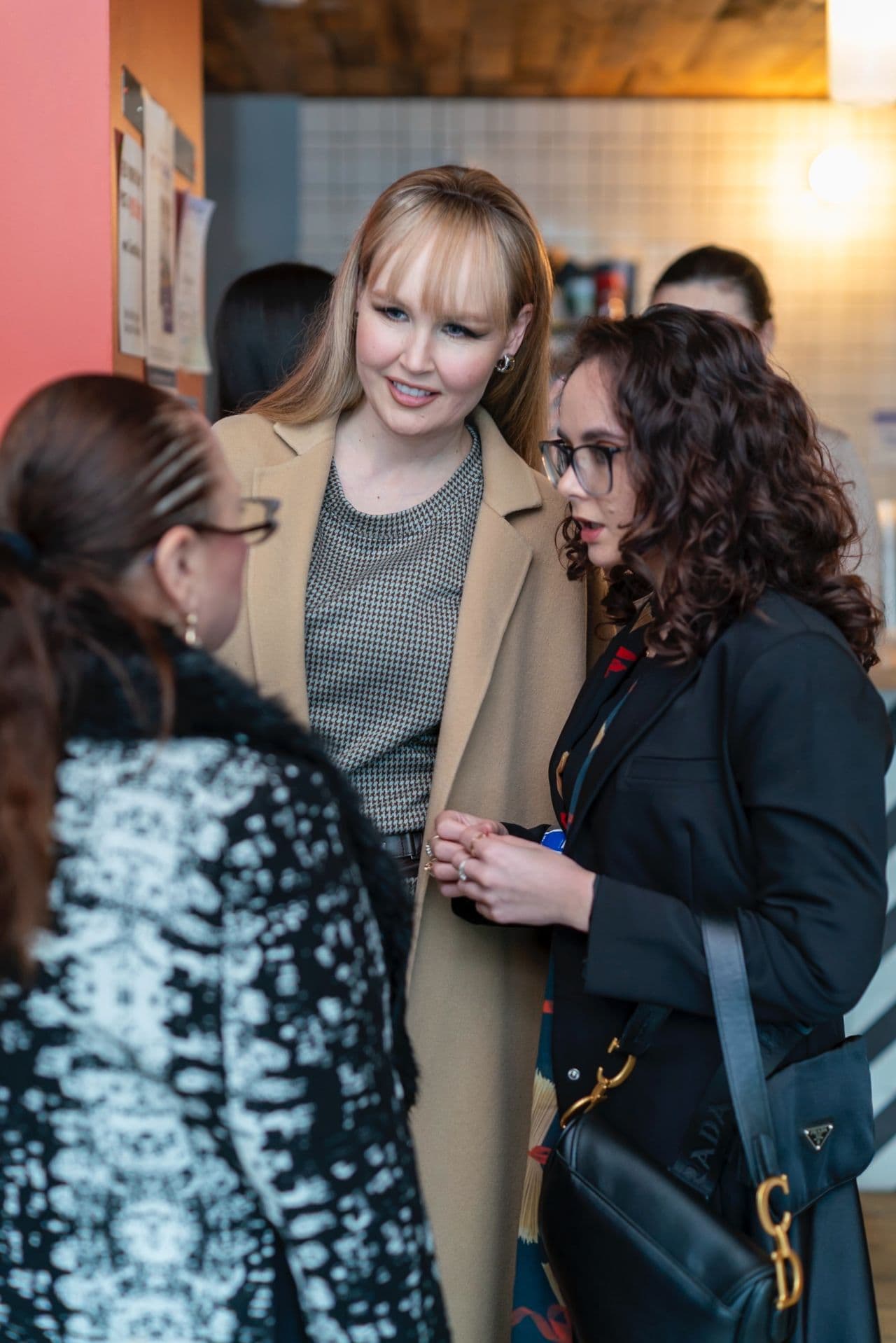 Attendees in conversation at a SFPLAYGROUND event