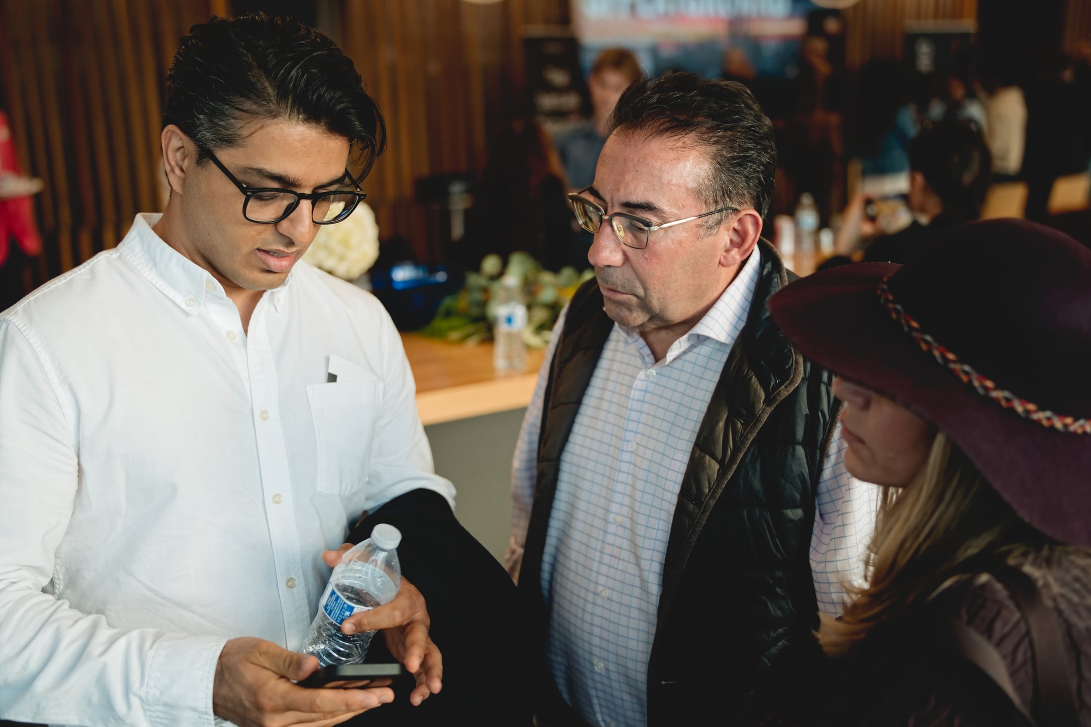 Founders and investors networking after a summit